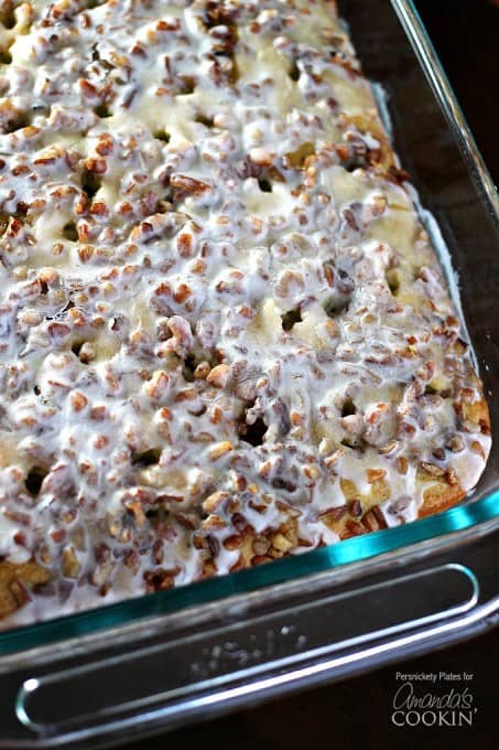 Overhead close up photo of Pistachio Poke Cake in a glass pan