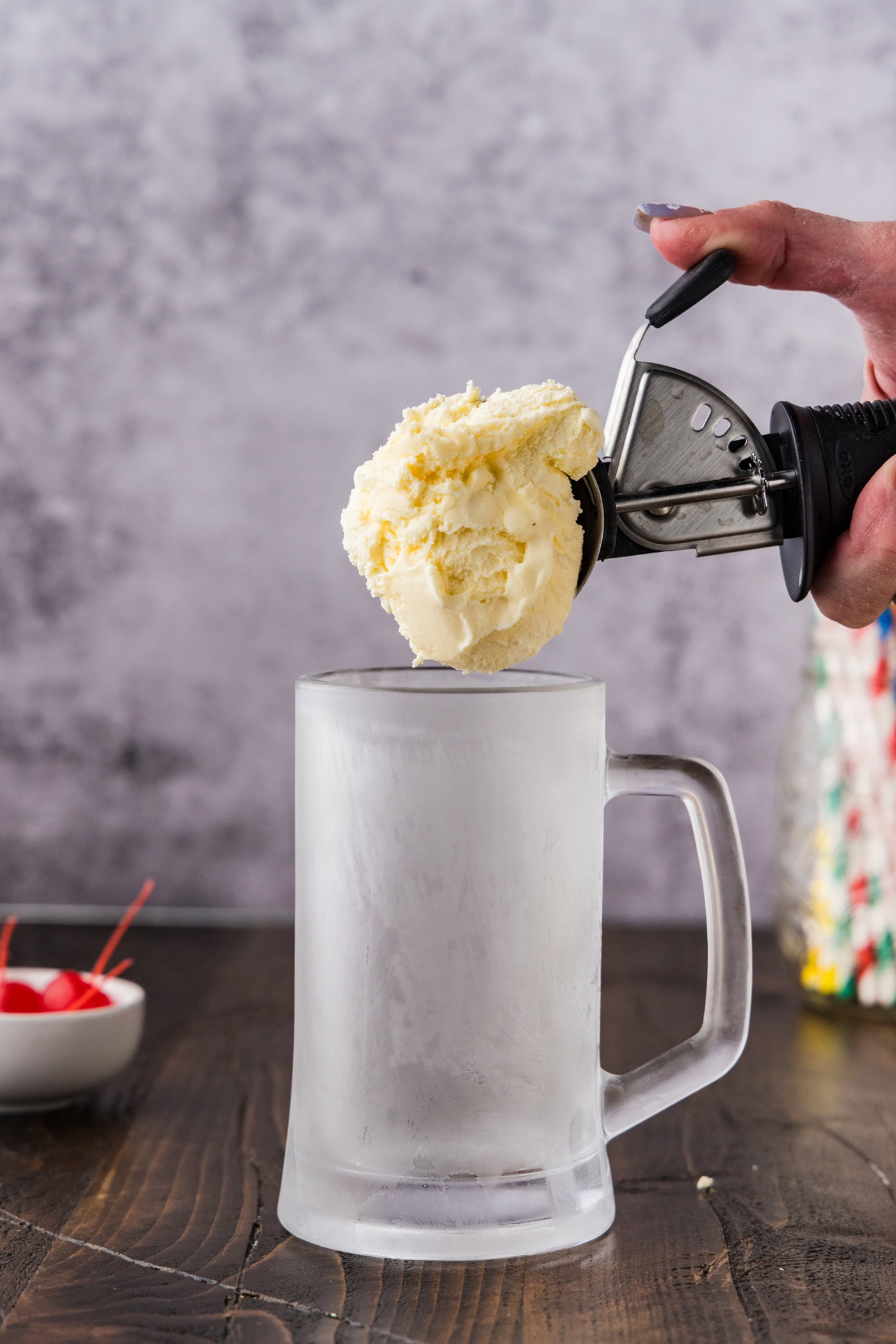 scooping ice cream into mug
