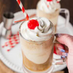 hand lifting a Root Beer Float Cocktail