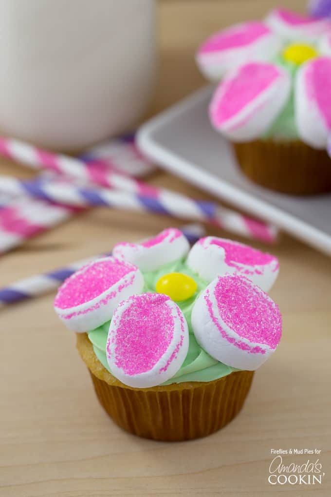 A close up of a marshmallow flower cupcake.