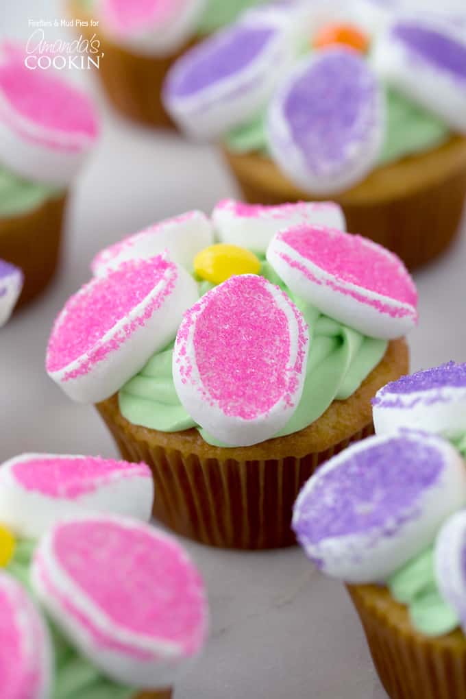 A close up of a marshmallow flower cupcakes.