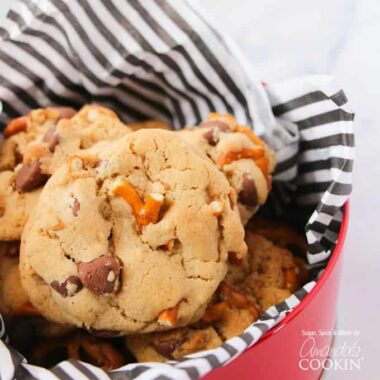 A close up photo of pretzel chocolate chip cookies in a tin.