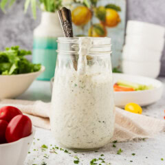 jar of Homemade Buttermilk Ranch Dressing with dressing dripping down the side