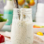jar of Homemade Buttermilk Ranch Dressing with a spoon in it