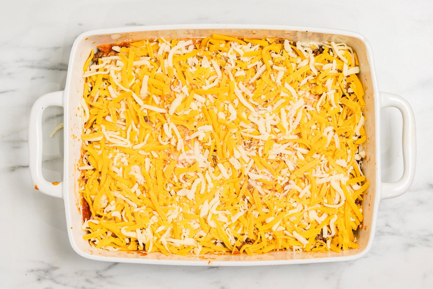 shredded cheese in baking dish