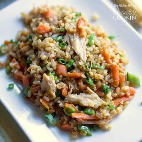 An overhead photo of teriyaki chicken and rice on a white plate.