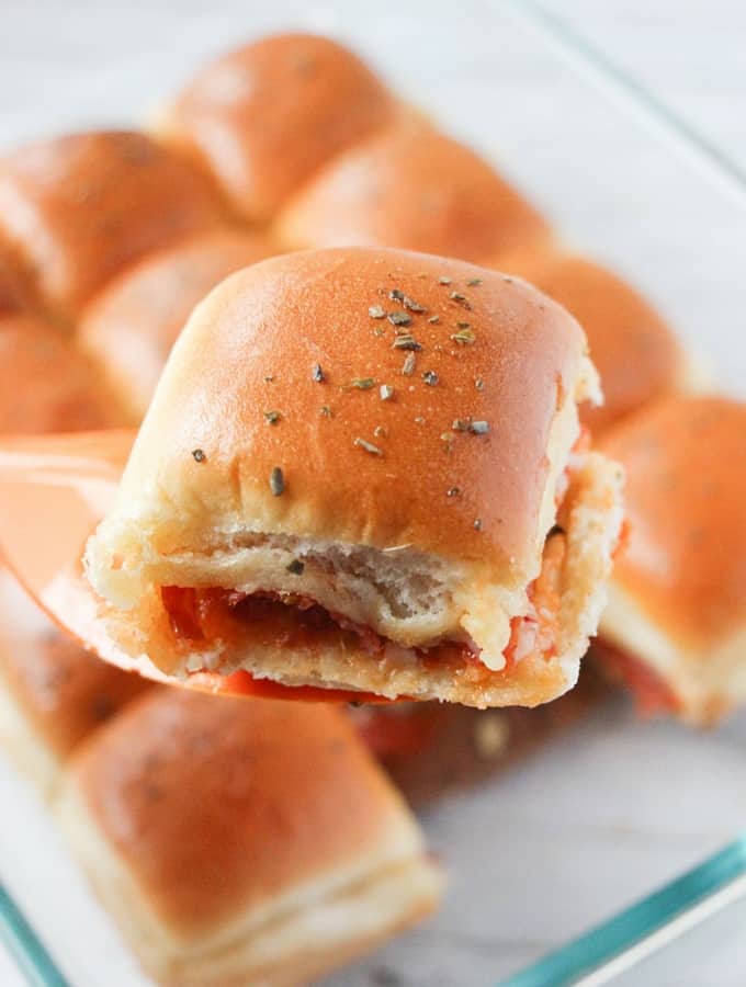 This pizza sandwich casserole, or you could call them pizza sliders, is perfect for a potluck or party. A great pizza flavored take along everyone loves!