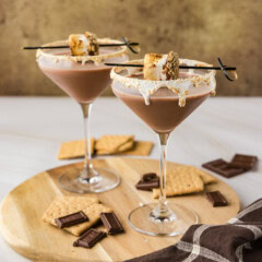 2 S'mores Martinis on a wood platter