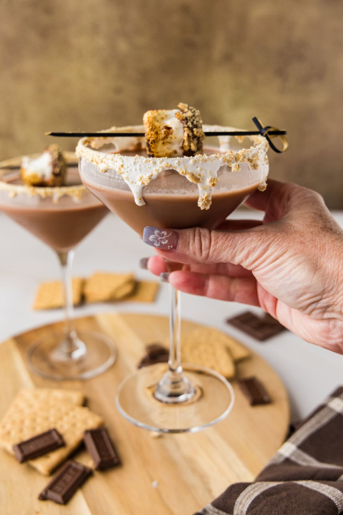 hand lifting a S'mores Martini