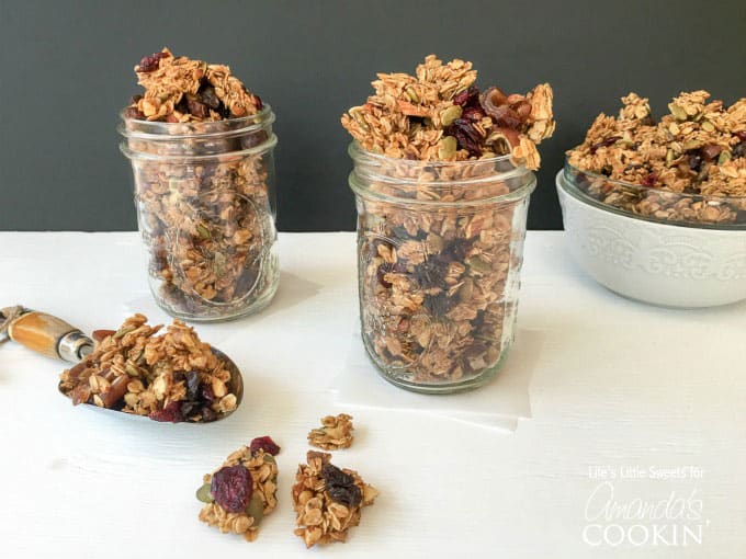 Autumn harvest fruit and nut granola in mason jars.