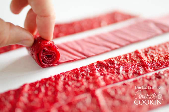 A close up of homemade fruit roll ups bring rolled.