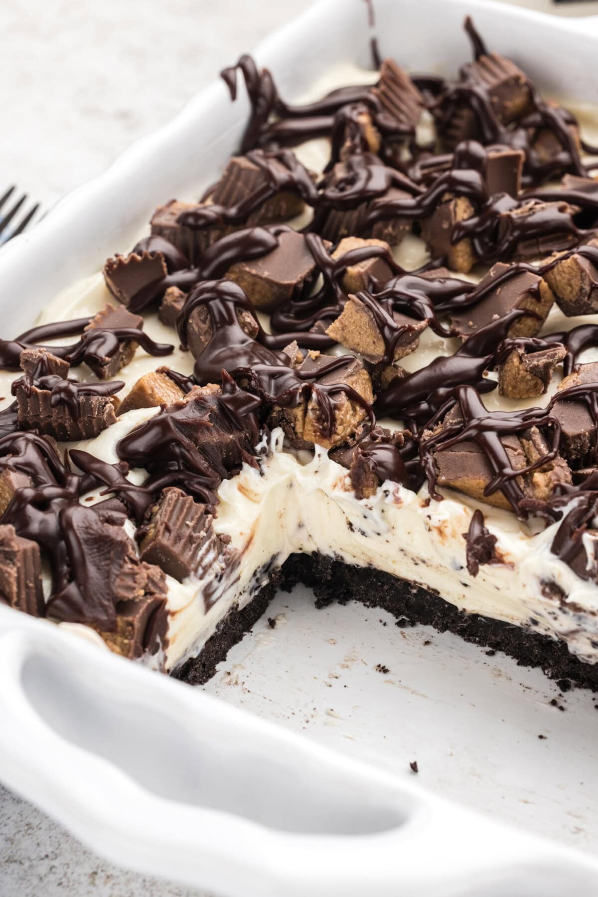  Peanut Butter Oreo No Bake Cheesecake  with slices removed