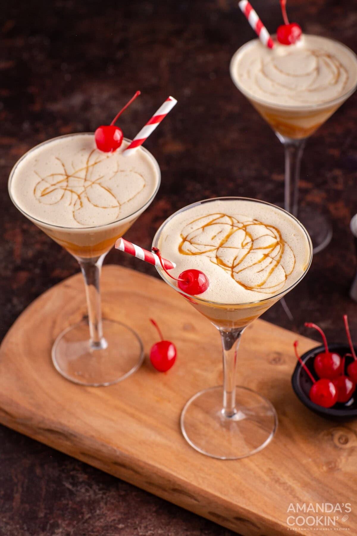 butterscotch milkshake cocktail in a martini glass with a cherry garnish