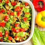 An overhead of taco casserole in a large baking dish.