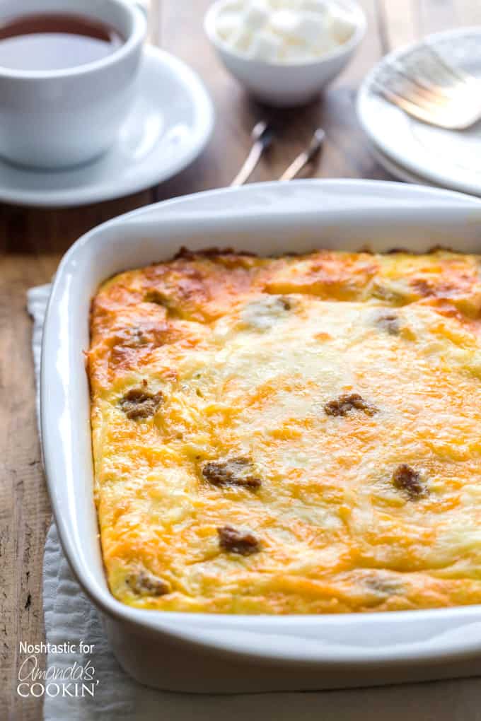 A close up of a white baking dish filled with fresh baked turkey hash brown breakfast casserole