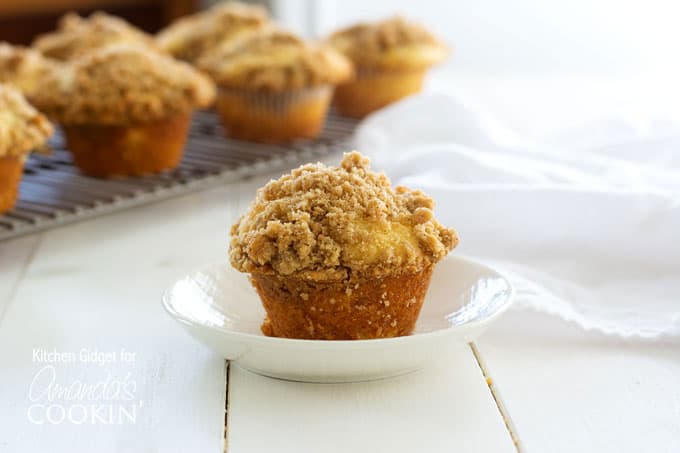 A cinnamon streusel muffin in a white bowl.