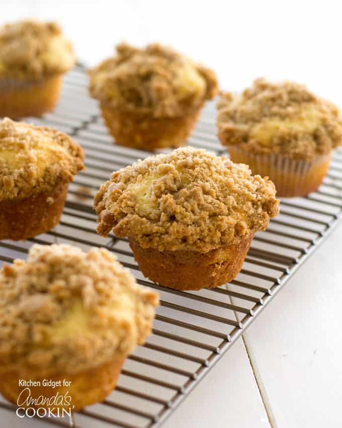 Cinnamon streusel muffins on a cooling rack.