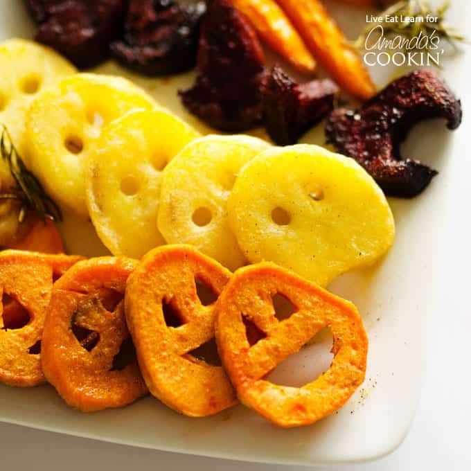 A close up photo of roasted Halloween vegetables laying on a platter.