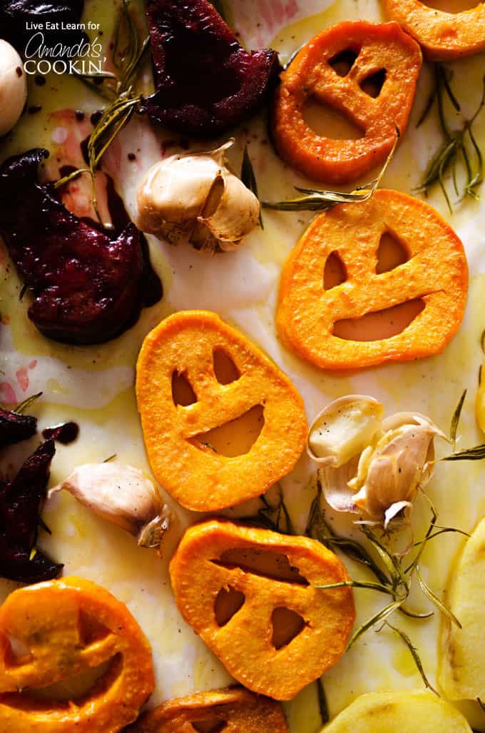 A close up overhead photo of roasted Halloween vegetables.