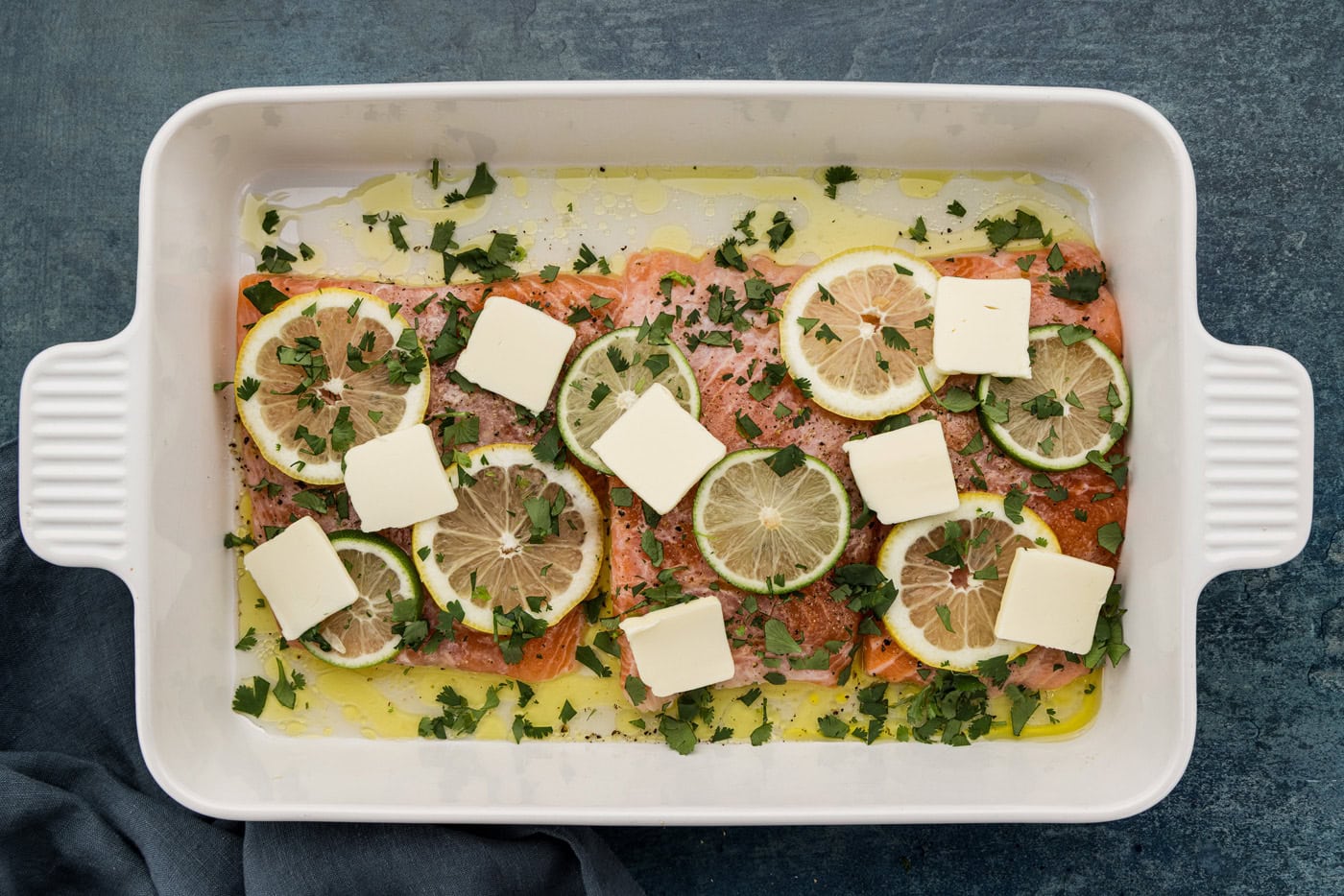 raw salmon with lemons, limes, and butter
