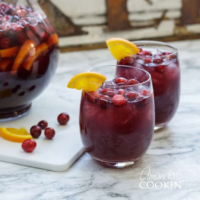 two glasses of sangria with orange wedge