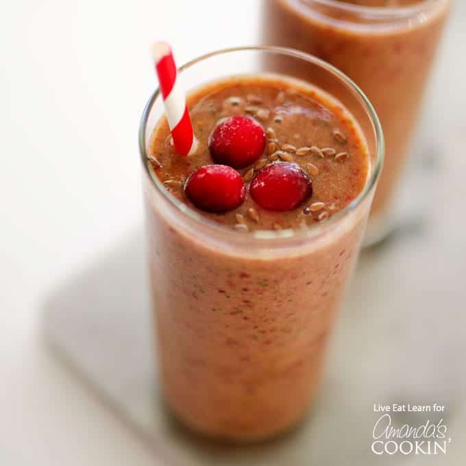 Cranberry Smoothie in s glass with straw