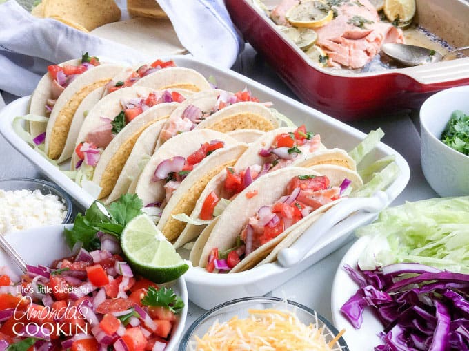 A photo of salmon tacos resting in a casserole dish.