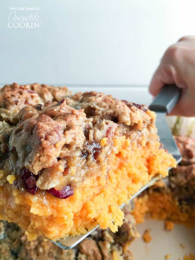 A close up of oatmeal cookie sweet potato casserole on a spatula. 