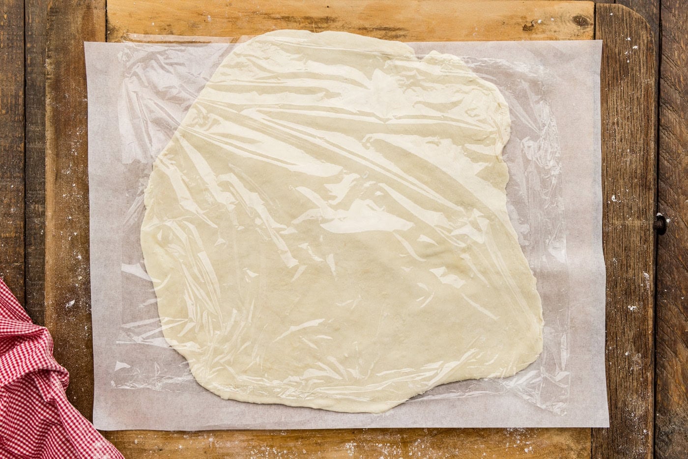 top crust under plastic wrap