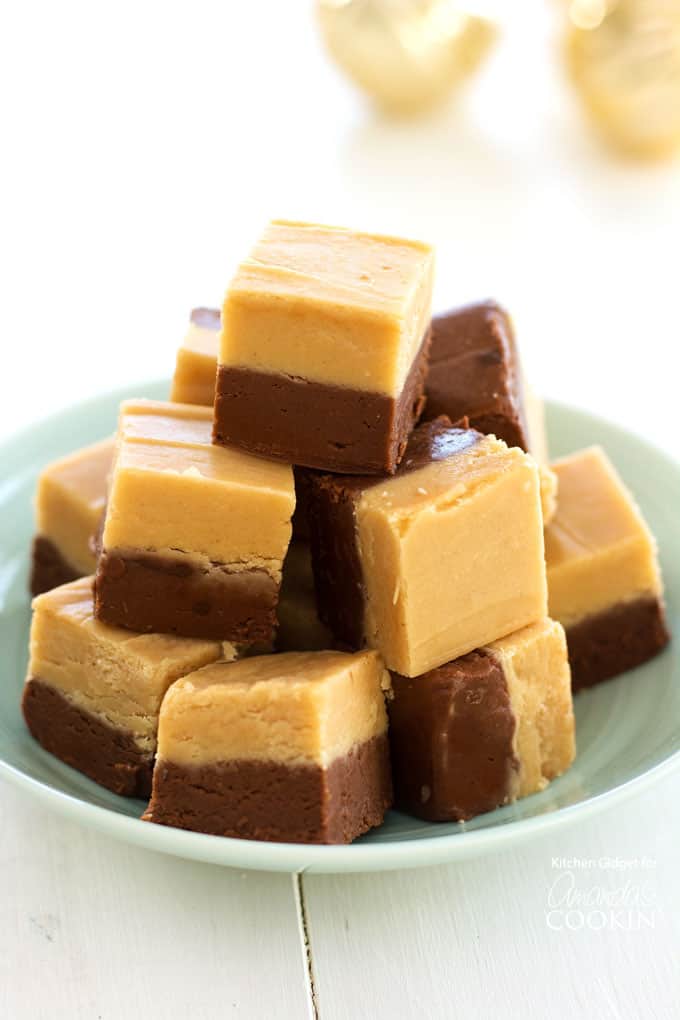 stack of chocolate peanut butter fudge squares on a plate
