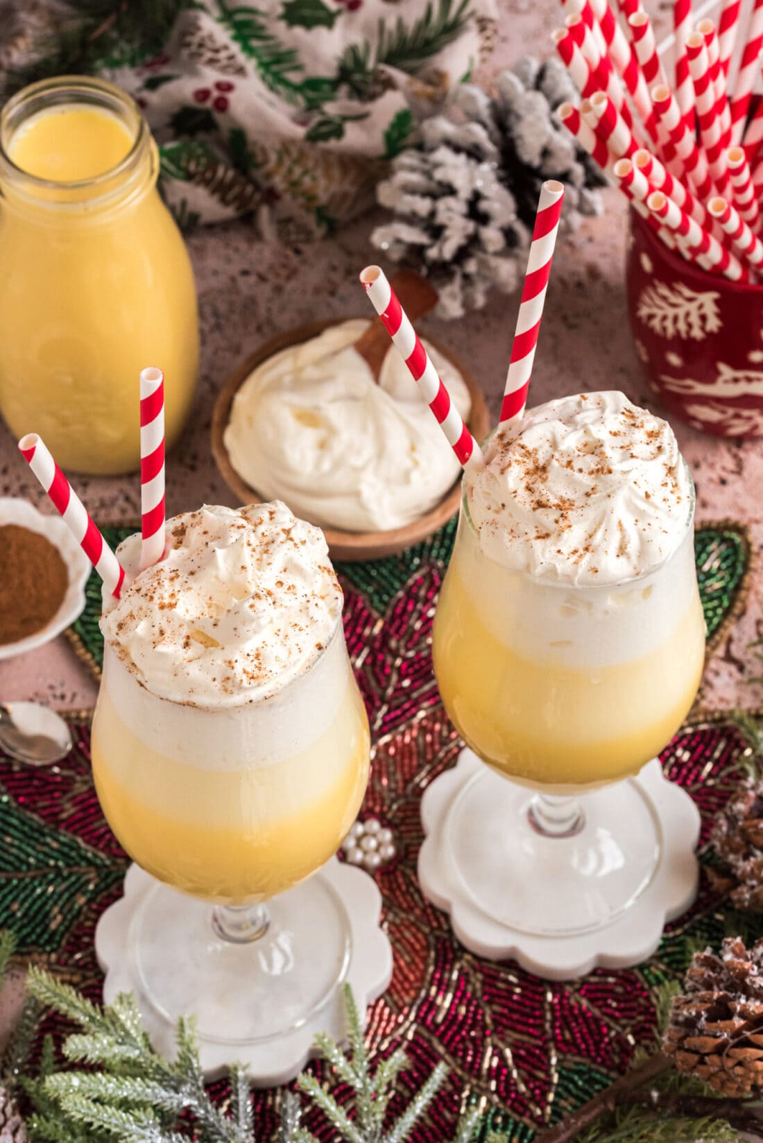 Two Eggnog Floats topped with whipped cream