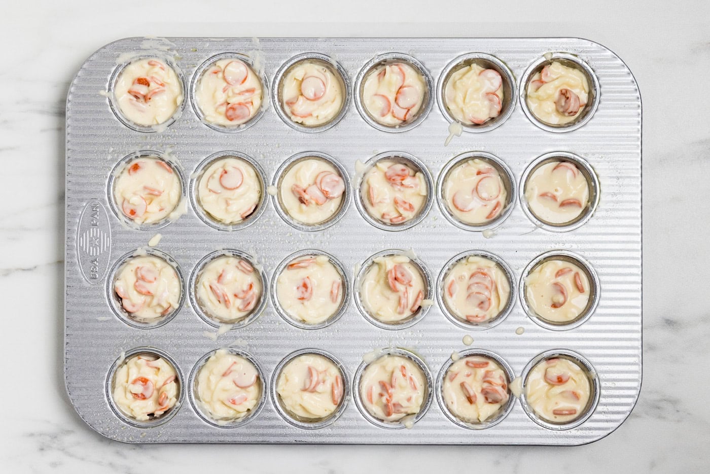 Pepperoni Pizza Puffs batter in mini muffin tin