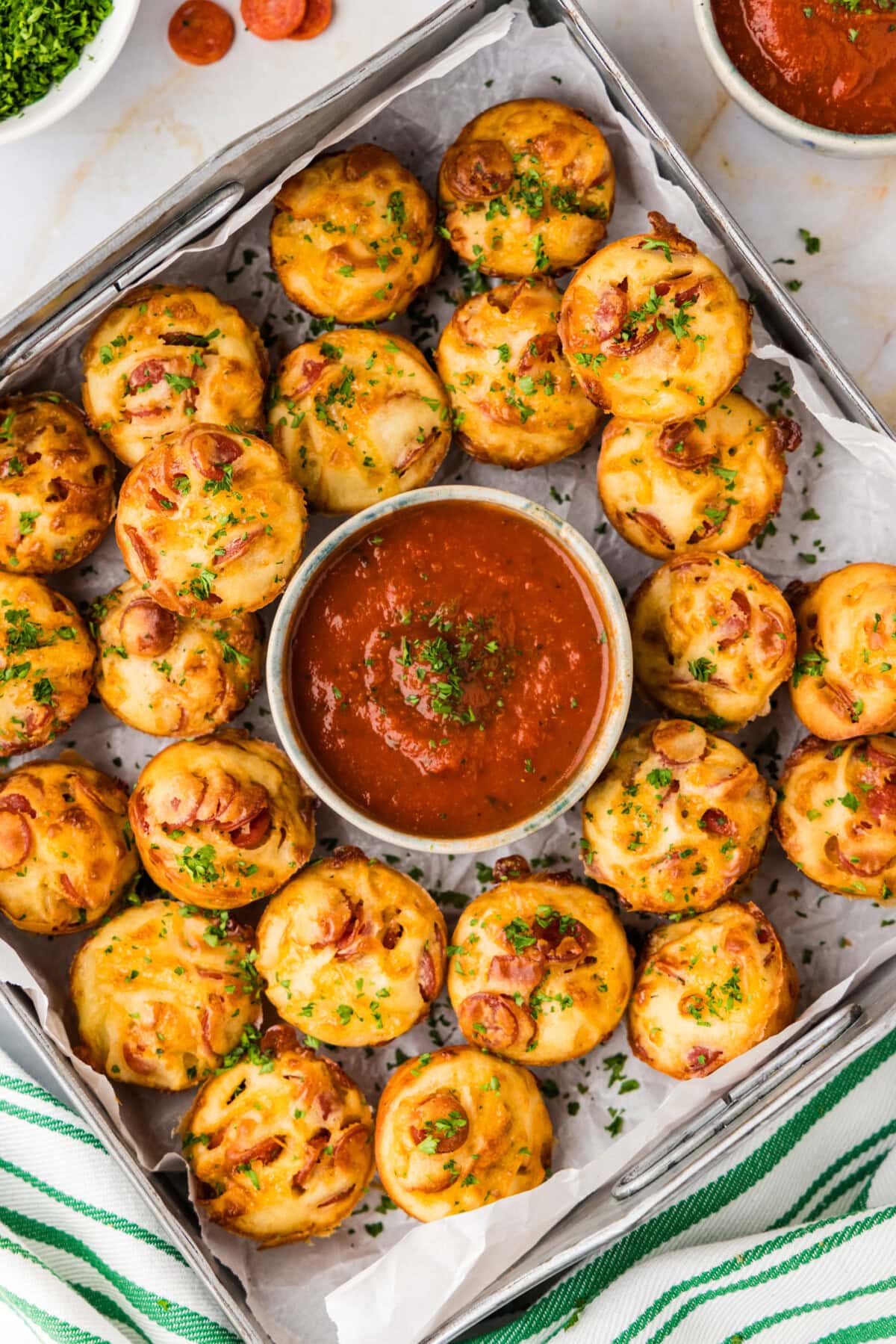 try of Pepperoni Pizza Puffs with a bowl of marinara