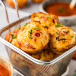 small wire basket holding Pepperoni Pizza Puffs
