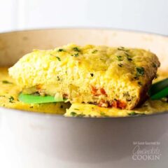 A serving of vegetable frittata on a spatula.