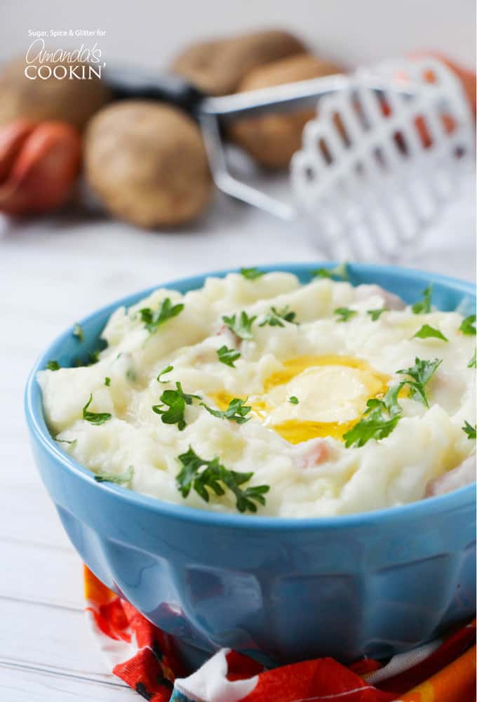 A close up of Colcannon mashed potatoes in a blue bowl.