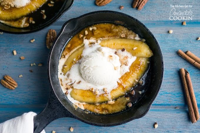 Single serve banana foster topped with vanilla ice cream in a 5\" skillet.