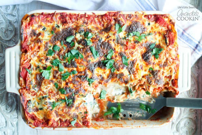 pan of veggie lasagna, slice removed, spatula where slice was