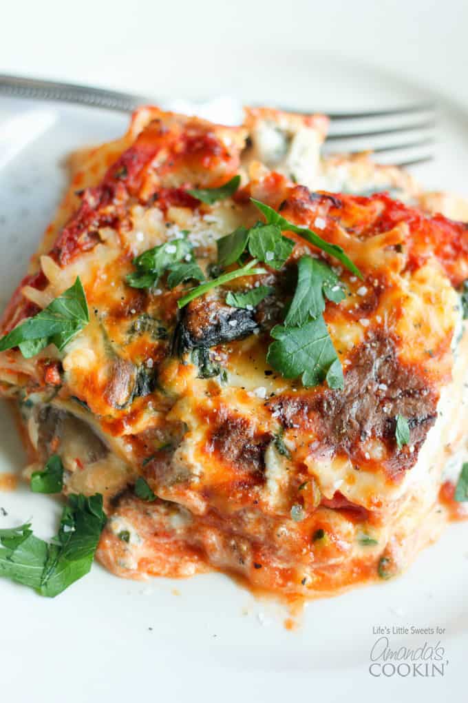 slice of veggie lasagna garnished with parsley