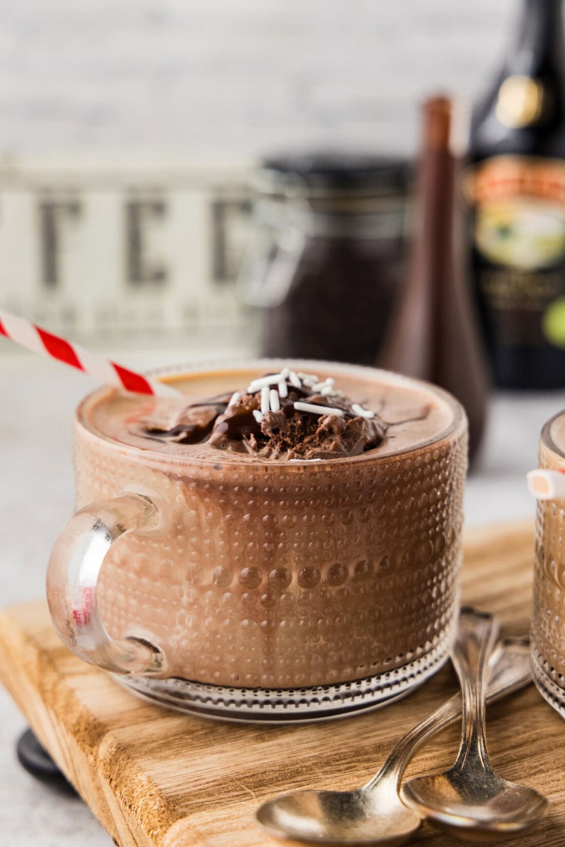 Side photo of a baileys coffee float with chocolate syrup on top
