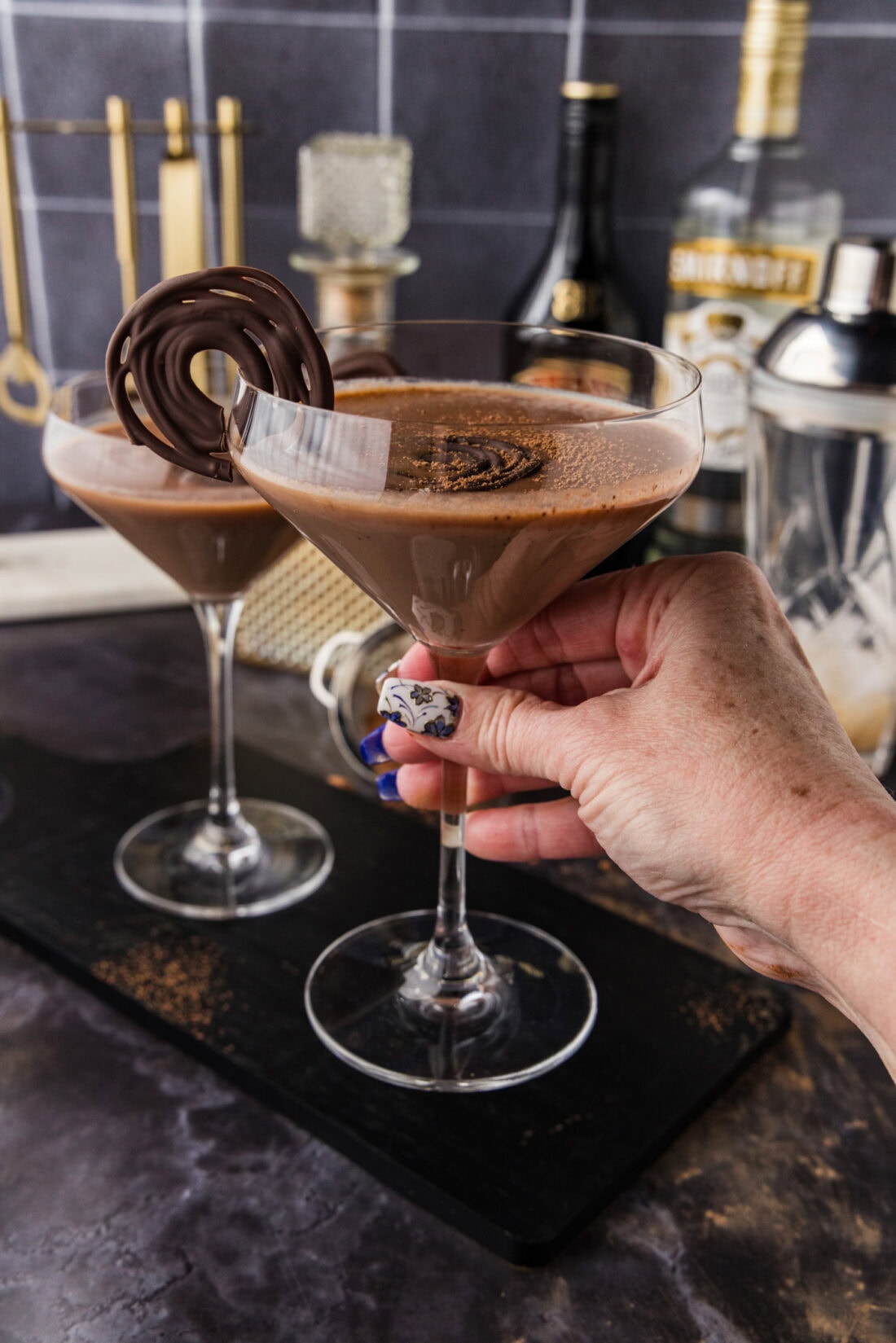 Hand holding up a Baileys Chocolate Martini