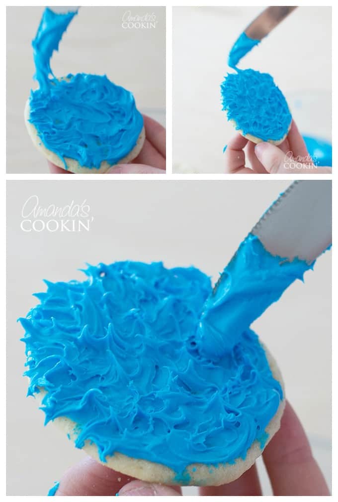 spreading blue frosting on a cookie