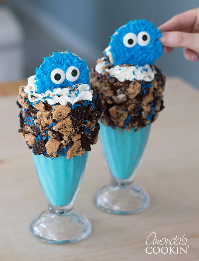 Add your adorable Cookie Monster cookies to the top of your milkshake (place in the middle).