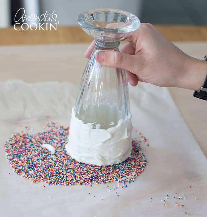 Dipping milkshake glass into sprinkles