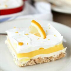 A piece of layered lemon dessert on a plate