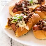 chili dogs on a white plate