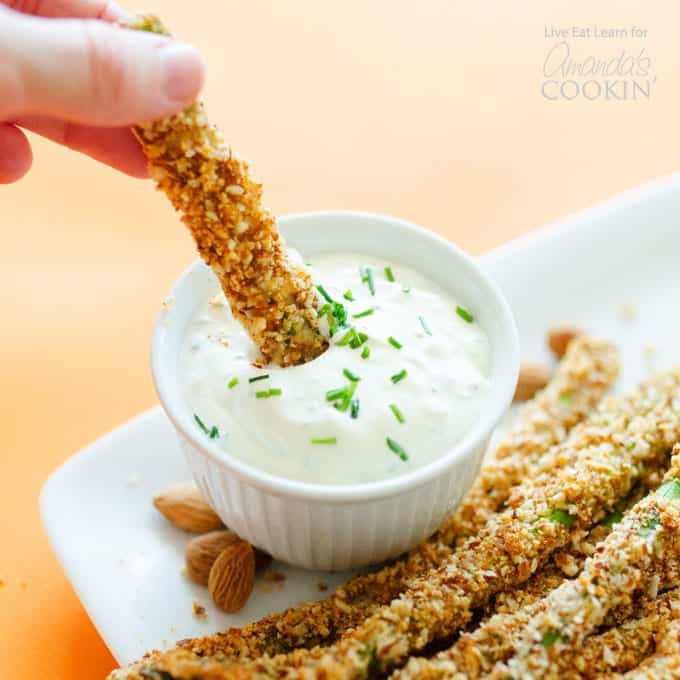 asparagus fries being dipped in sauce