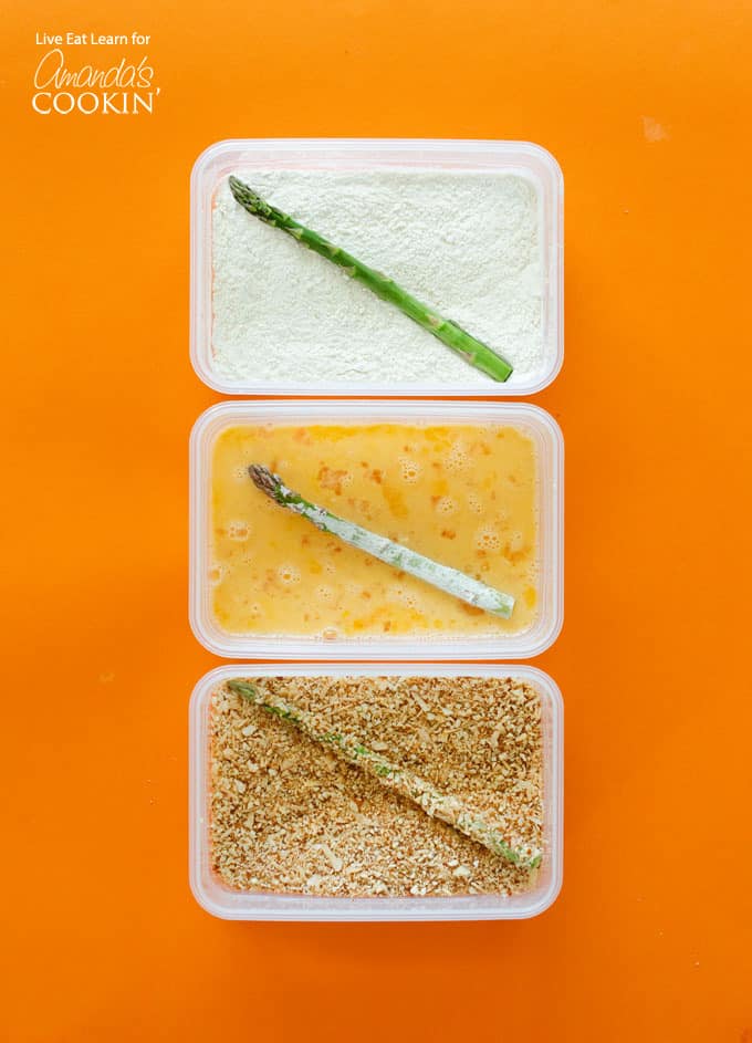 three trays showing the steps for making asparagus fries