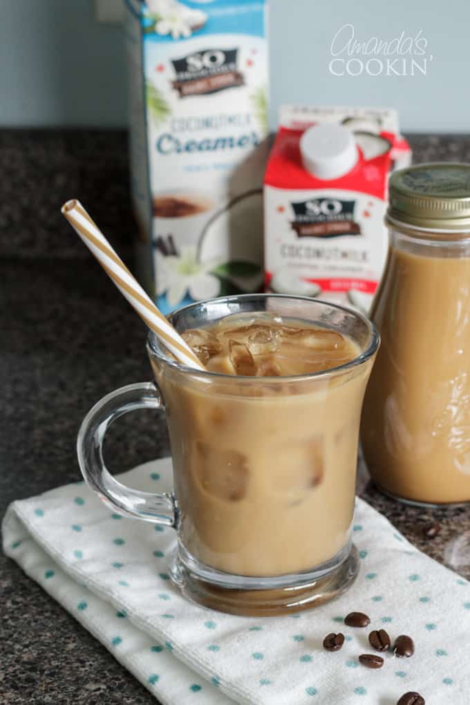 paper straw in a glass of cold brewed iced coffee