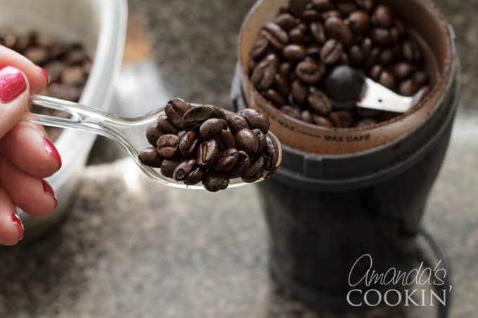 coffee beans into grinder